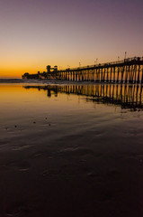 Fototapeta na wymiar Pier & colorful sunset in Oceanside, California, USA