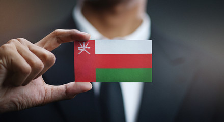Businessman Holding Card Oman Flag 
