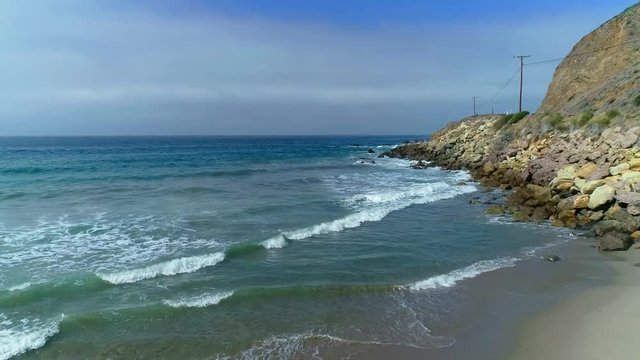 Ocean with rocks and homes