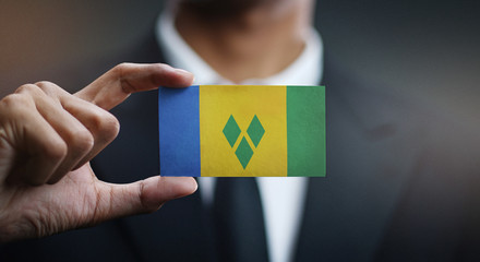 Businessman Holding Card of Saint Vincent and the Grenadines Flag