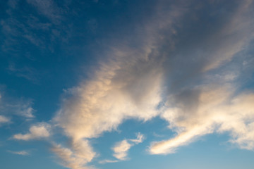 Fluffly white clouds on a blue sky.