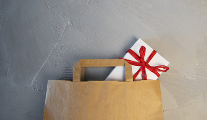 gift boxes in bag and shopping mall on the green table with the holiday season