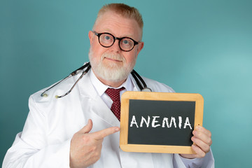 Doctor holding chalkboard with Anemia lettering