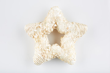 Star shaped Christmas tree decorations on white background