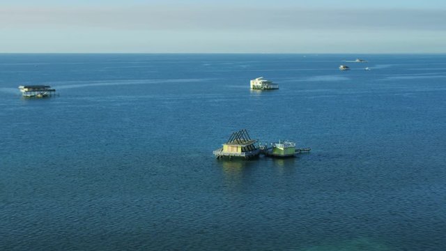 Aerial view at sunrise of Stiltsville wooden shacks Biscayne Channel Sand banks Cape Florida National Park Miami America 