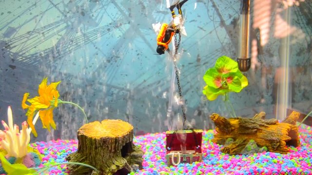 This scuba diver has been haplessly trying to yank his newfound treasure chest to the surface of his aquarium all day. We all feel like him sometimes.