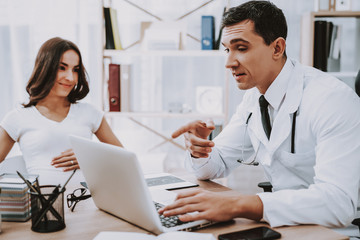 Fototapeta premium Pregnant Girl at the Gynecologist Doctor