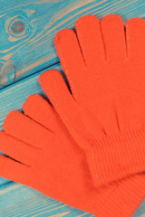 Red gloves for woman made of cotton or wool, clothing for autumn or winter concept