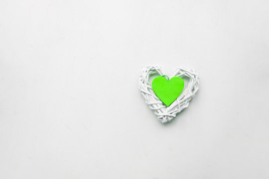 Green Valentine hearts on white background. Valentine's day concept Holiday.copy space.Green paece creative concept.Symbol of love, care about earth and nature.Green energy.