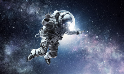 Fototapeta premium Astronaut on space mission. Mixed media