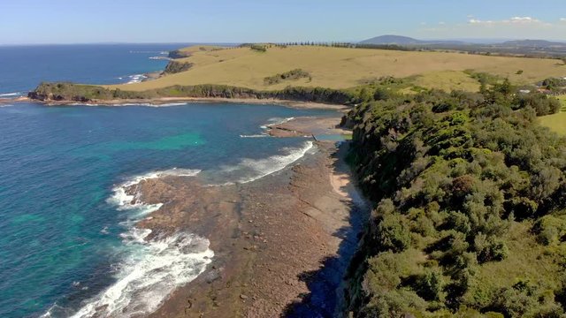 Aerial footage of cliffs and coastline over Gerringong, NSW, Australia
