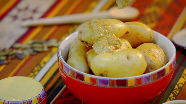 Yellow cooked potatoes on a bowl