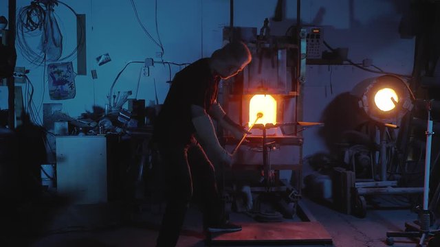 glassblower working in the workshop