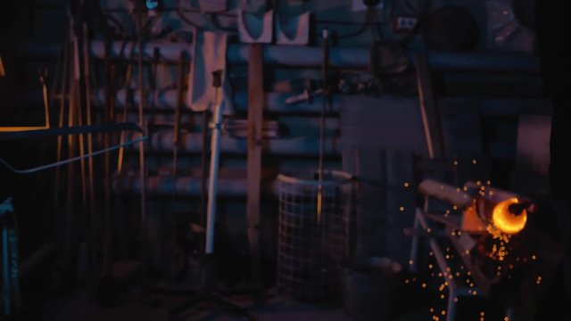 glassblower working in the workshop