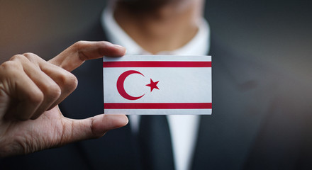 Businessman Holding Card of Northern Cyprus Flag