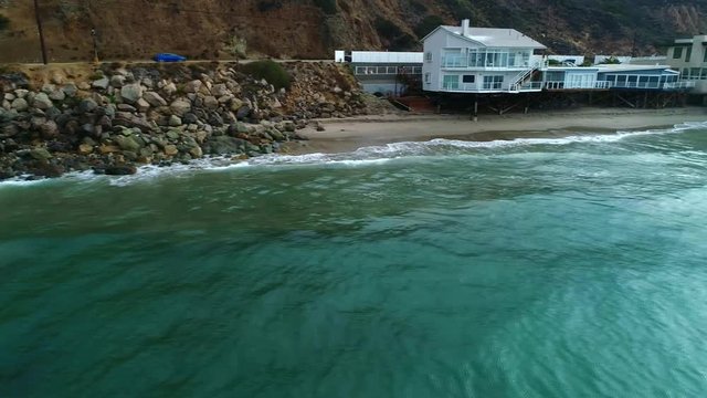 Ocean with rocks and homes