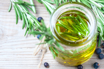 Bottle of extra virgin olive oil with rosemary.