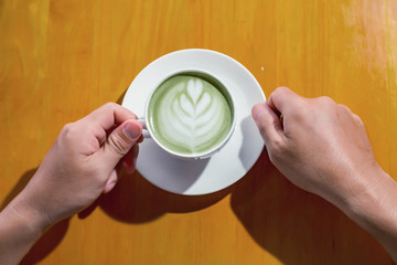 Man eating green tea with milk