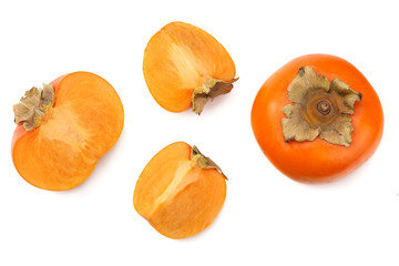 fresh ripe persimmons with slices isolated on white background. top view