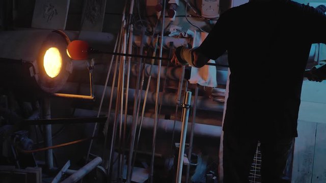 glassblower working in the workshop