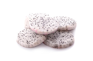 dragon fruit with drops of water on white background.