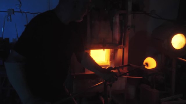 glassblower working in the workshop