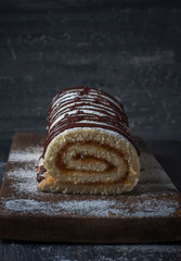 Biscuit roll with jam on old  background