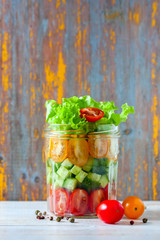 Fresh vegetable salad in a mason jar. Trends in healthy eating.