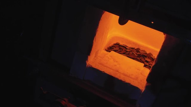 glassblower working in the workshop