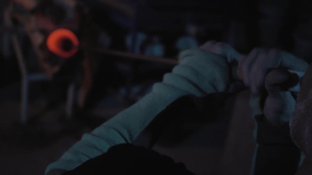 glassblower working in the workshop