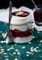 Healthy layered dessert with  homemade yogurt, with jam and  gra