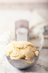 Homemade creamy ice cream in metal  scoop.