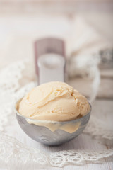 Fototapeta na wymiar Homemade creamy ice cream in metal scoop.
