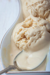 Homemade creamy ice cream in metal  scoop.