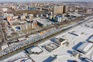 Tyumen, Russia - March 11, 2016: The railroad along 50 let VLKSM Street, dividing residential and industrial districts of city