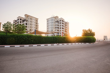 Obraz premium September 12, 2017 - Al Hamra Village in Ras al Khaimah, United Arab Emirates. View of luxury community Al Hamra Village at sunrise. Modern arabian private residential area with multi-storey houses.