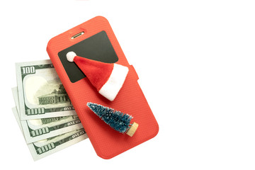 Three hundred US dollars, a smartphone in a red case, a Christmas tree and a Santa Claus souvenir and on a white background. The concept of the New Year bonus and financial balance.Isolated.Copyspace.