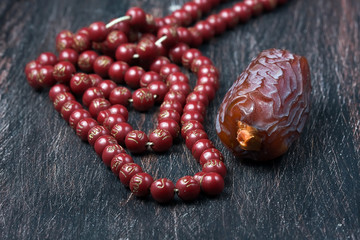 Dates fruit and rosary still life