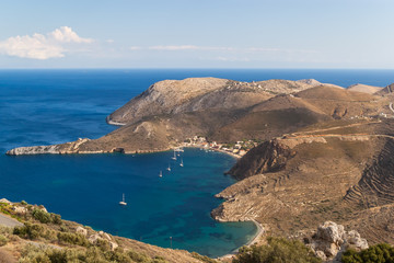Fototapeta na wymiar The picturesque bay of Porto Kagio and the cape Tanaro where the waters of the Aegean and Ionian seas are collected. Photo taken September 2018, Mani Peninsula, Peloponnese, Greece.