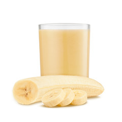 Fresh banana shake in a glass and banana pieces isolated on white background © YB