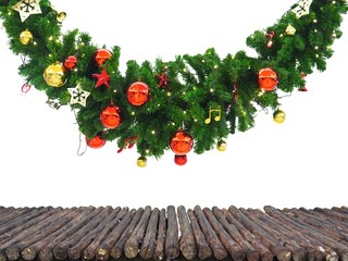 Wooden table from logs and space available for placing objects blur Christmas tree with decorations...
