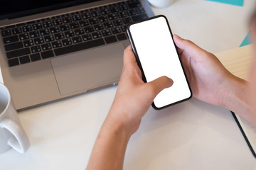 Cropped shot hands using smartphone with empty screen display mobile.