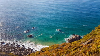 Cliffs over the Atlantic ocean. The westernmost point in Europe. The edge of the land. Cape Roca or Cabo da Roca, Portugal.