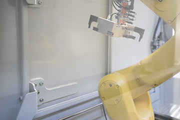 Industrial robots in production line manufacturer factory / Industrial robots in motion.