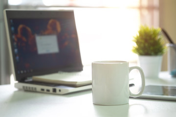 Mug Coffee on business work table.
