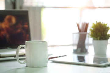 Mug Coffee on business work table.
