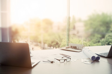 Architectural desk, engineer table construction site, soft focus, vintage tone, working with...