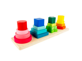 Wooden toy geometric four column with different size for child development isolated on a white background, Logical thinking or problem solving.