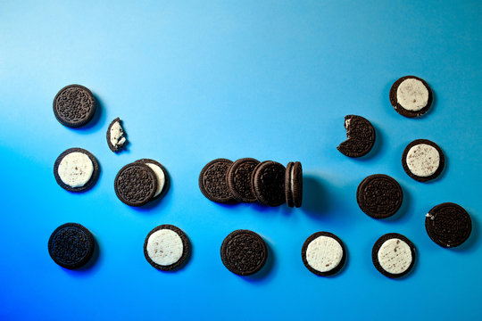 Oreo cookies, Chocolate cream filling sandwich cookies on a blue background  Stock Photo | Adobe Stock