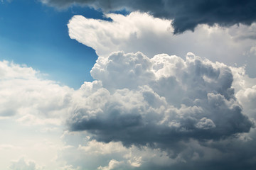White curly clouds in a blue sky. Sky background